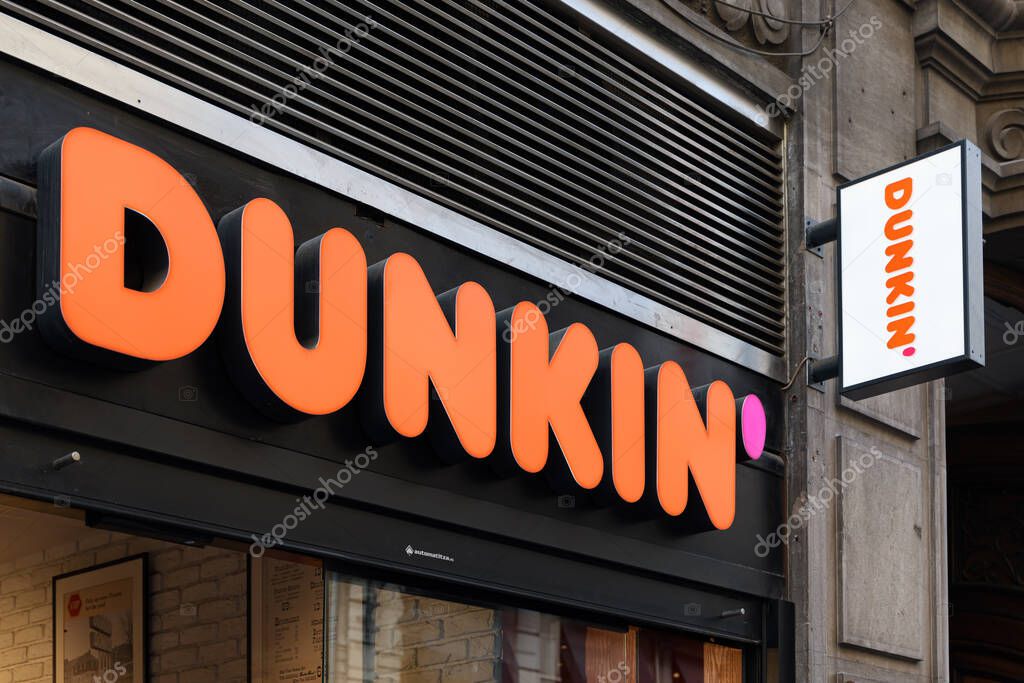 VALENCIA, SPAIN - NOVEMBER 15, 2021: Dunkin is an American multinational coffee and doughnut company