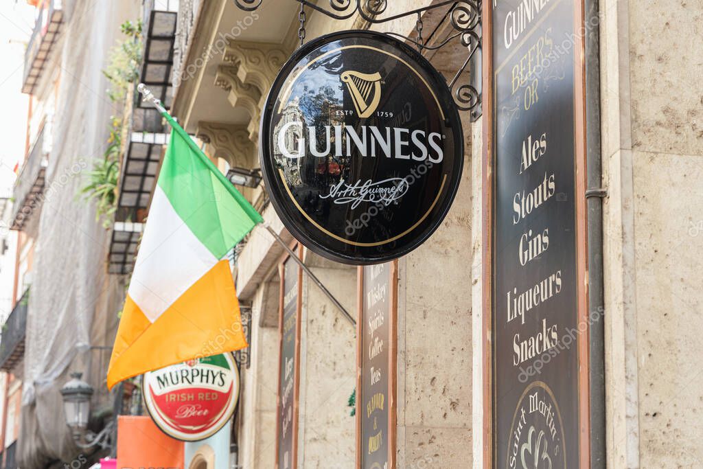 VALENCIA, SPAIN - NOVEMBER 19, 2021: Guinness is an Irish dry stout. It is one of the most successful alcohol brands
