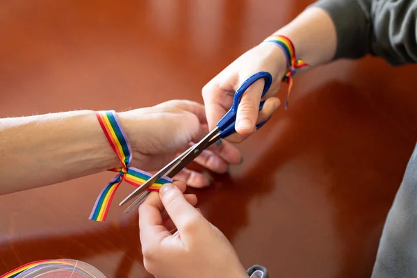 Girl Putting Lgbt Rainbow Bracelet Woman Wrist — Stock fotografie