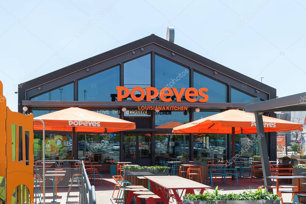 ALFAFAR, SPAIN - JUNE 06, 2022: Popeyes is an American multinational chain of fried chicken fast food restaurants