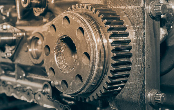 Black and White Center Frame Zoom View Crankshaft Gear and Bolt on Cylinder Block of Truck Engine