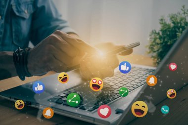 Casual Businessman Touching Mobile Phone or Smart Phone Screen and Bottom Social Media Emoticon Such As Smile, Like, Love, Heart, Share Icon. Communication or Online Contact Concept in Vintage Tone