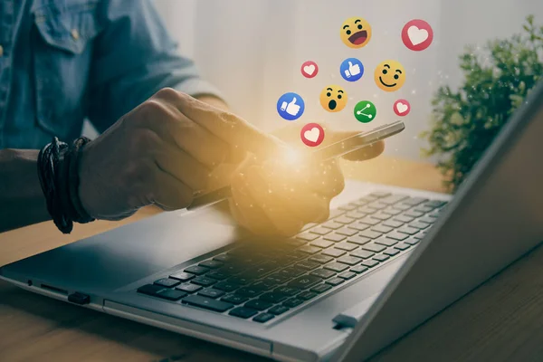 Casual Businessman Touching Mobile Phone or Smart Phone Screen and Social Media Emoticon Such As Smile, Like, Love, Heart, Share Icon. Communication or Online Contact Concept in Vintage Tone