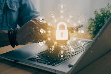 Casual Businessman Hand Touching Mobile Phone or Smart Phone Screen and Circle Lock Security Sign and Laptop Computer. Secure or Firewall and Protection Concept in Vintage Tone in Vintage Tone