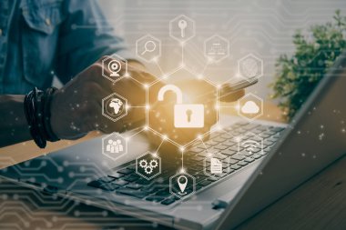Casual Businessman Hand Touching Mobile Phone or Smart Phone Screen and Hexagonal Unlock Security Sign and Laptop Computer. Secure or Firewall and Protection Concept in Vintage Tone