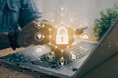 Casual Businessman Hand Touching Mobile Phone or Smart Phone Screen and Hexagon Lock Security Sign and Laptop Computer. Secure or Firewall and Protection Concept in Vintage Tone