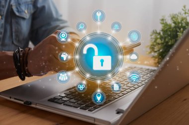 Casual Businessman Hand Touching Mobile Phone or Smart Phone Screen and Blue Circle Unlock Security Sign and Laptop Computer. Secure or Firewall and Protection Concept