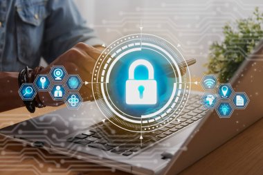 Casual Businessman Hand Touching Mobile Phone or Smart Phone Screen and Blue Lock Security Sign and Laptop Computer. Secure or Firewall and Protection Concept