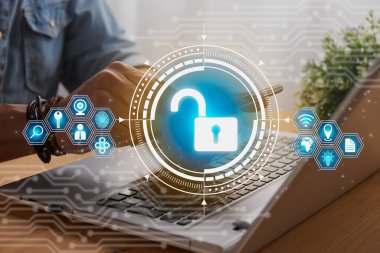 Casual Businessman Hand Touching Mobile Phone or Smart Phone Screen and Blue Unlock Security Sign and Laptop Computer. Secure or Firewall and Protection Concept