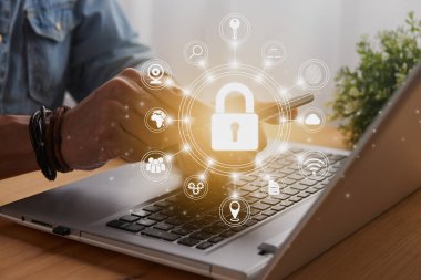 Casual Businessman Hand Touching Mobile Phone or Smart Phone Screen and Circle Lock Security Sign and Laptop Computer. Secure or Firewall and Protection Concept