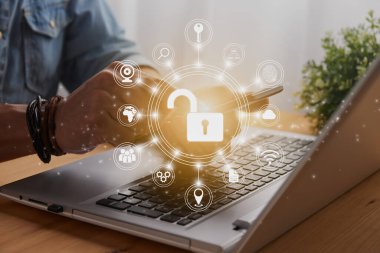 Casual Businessman Hand Touching Mobile Phone or Smart Phone Screen and Circle Unlock Security Sign and Laptop Computer. Secure or Firewall and Protection Concept