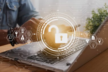 Casual Businessman Hand Touching Mobile Phone or Smart Phone Screen and Unlock Security Sign and Laptop Computer. Secure or Firewall and Protection Concept