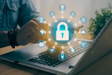 Casual Businessman Hand Touching Mobile Phone or Smart Phone Screen and Blue Circle Lock Security Sign and Laptop Computer. Secure or Firewall and Protection Concept in Vintage Tone