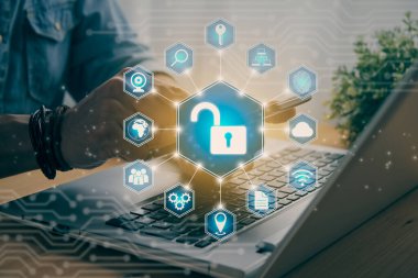 Casual Businessman Hand Touching Mobile Phone or Smart Phone Screen and Blue Hexagonal Unlock Security Sign and Laptop Computer. Secure or Firewall and Protection Concept in Vintage Tone