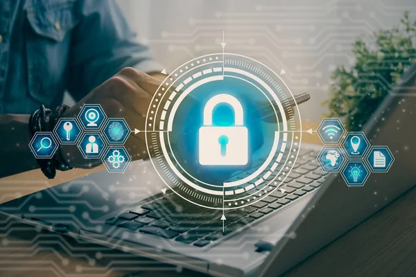 Casual Businessman Hand Touching Mobile Phone or Smart Phone Screen and Blue Lock Security Sign and Laptop Computer. Secure or Firewall and Protection Concept in Vintage Tone