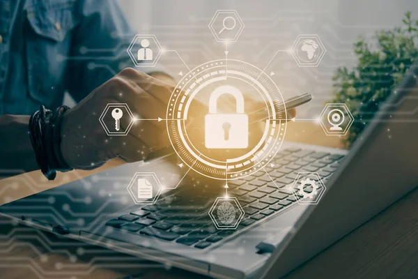 Casual Businessman Hand Touching Mobile Phone or Smart Phone Screen and Hexagon Lock Security Sign and Laptop Computer. Secure or Firewall and Protection Concept in Vintage Tone