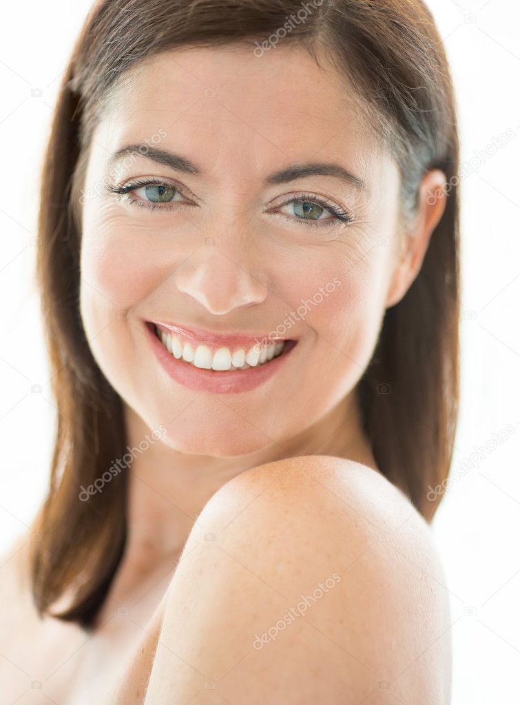attractive woman in her forties with bare shoulders