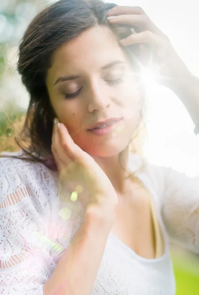 Multi-ethnic girl enjoying the warmth of a sunset — Stock Photo, Image