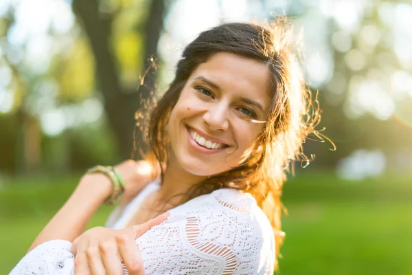 Multi-ethnic girl enjoying the warmth of a sunset — Stock Photo, Image