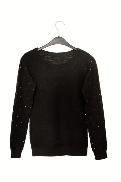 To jest czarny sweter z wystrój złoty. — Zdjęcie stockowe