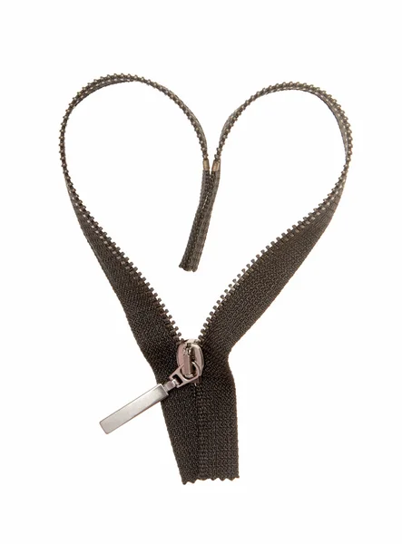 A black zipper is in heart's form. — Stock Photo, Image