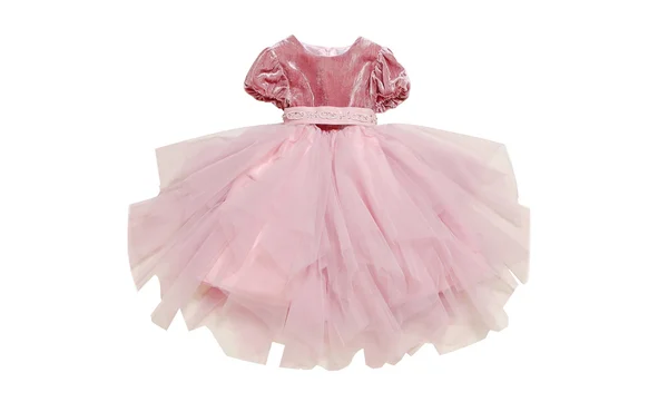 Flickans rosa klänning är isolerad. — Stockfoto