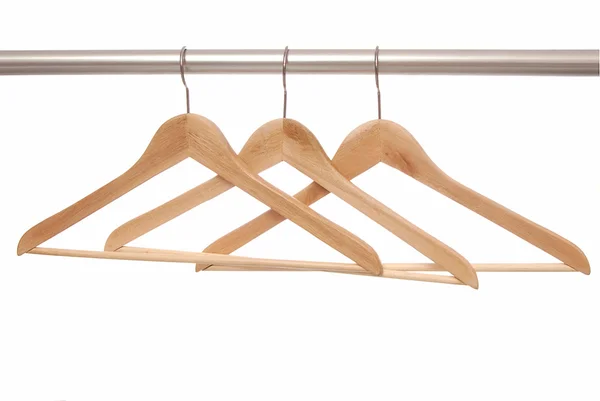 Empty wooden hangers are on white background. — Stock Photo, Image