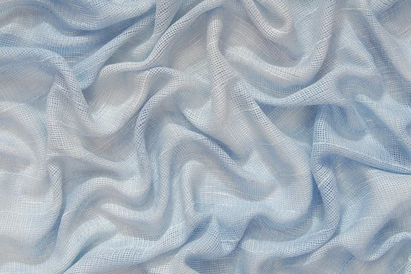 È un drappeggio di tessuto azzurro . — Foto Stock