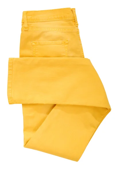 Folded yellow jeans — Stock Photo, Image