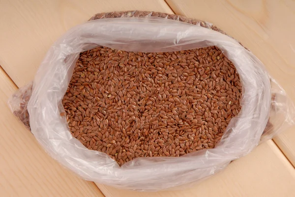 Linseed in plastic sachet — Stock Photo, Image