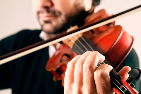 Close up Violinist playing with a stave background — Stock Photo, Image