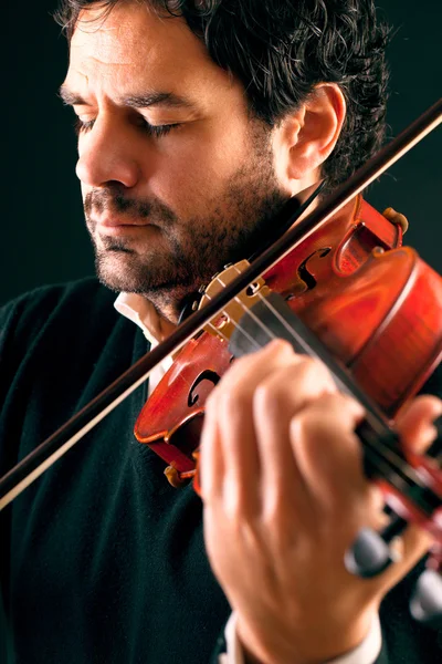 Violinist playing in black background. — Stock Photo, Image