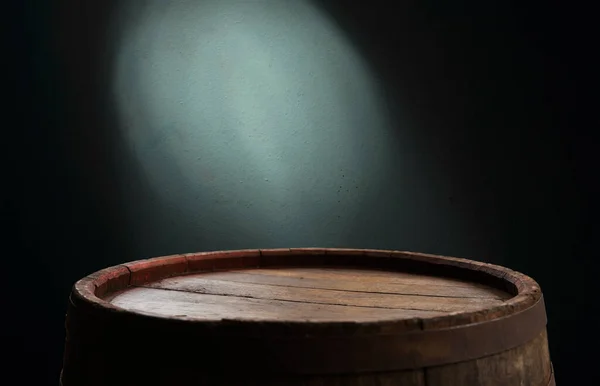 Beer. Still life with Vintage beer barrel and glass light beer. Fresh amber beer concept. Green hop and gold barley on wooden table. Ingredients for brewery. Brewing traditions