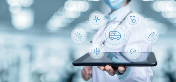 A medical worker shows on the tablet the structure of the ambulance.