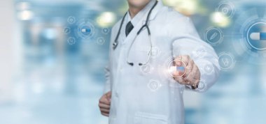 Doctor chooses a medicine on a virtual computer screen to treat an illness.