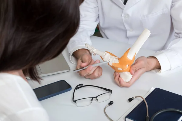 Doctor Explaining Anatomy Structure Ankle Joint Patient Office —  Fotos de Stock