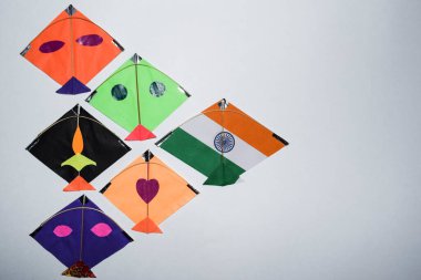 Multicolor Kites display on White background with blank space to write wishes and text. Happy sankranti greetings images