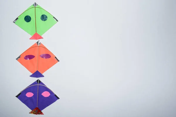 Multicolor Kites Display White Background Blank Space Write Wishes Text — стоковое фото