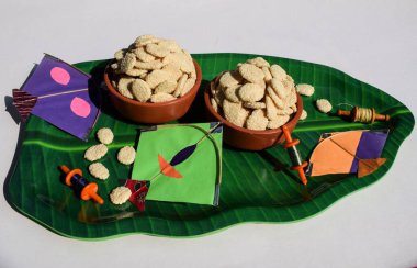 Indian sweet item called Rewri or revdi served and eaten during Makarsankranti festival. Rewri is made of Sesame seeds and sugar or Jaggery