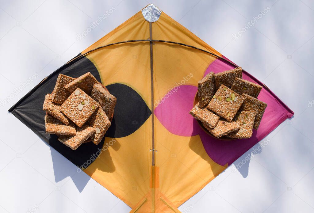 Badam Pista Gur Patti Gajak . It is made of jaggery and sesame slabs with almonds and pistachhio. Til chikki on kite for makarsankrant festival uttarayan kite patang