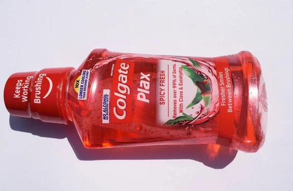 Bottle of Colgate Plax Max fresh antibacterial Mouth wash by brand Colgate by Palmolive in Spicy Fresh flavour red color. front view of Colgate mouthfresh