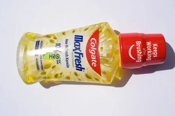 Bottle of Colgate Plax Max fresh antibacterial Mouth wash by brand Colgate by Palmolive in Spicy Fresh flavour yellow color. Backside view of Colgate mouthfresh