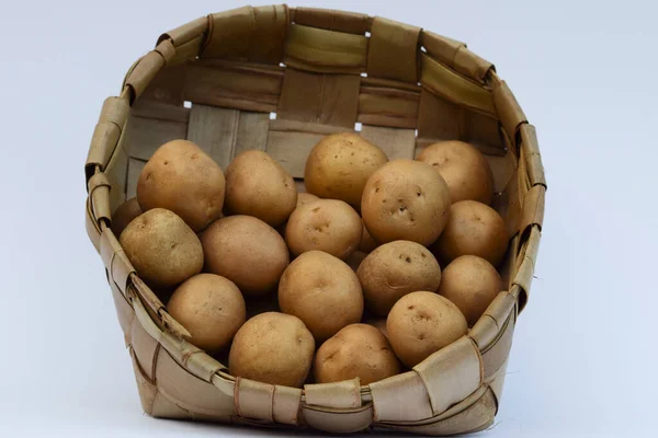 Potatoes in basket. Baby potatoes small round potato from india on white background Asian vegetables used in making many dishes cuisine items