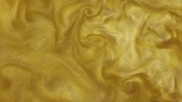 Abstract artistic shining background with sequins. The texture of golden of mother-of-pearl water. Metallic liquid, water movement. Bath salts — Stock Video
