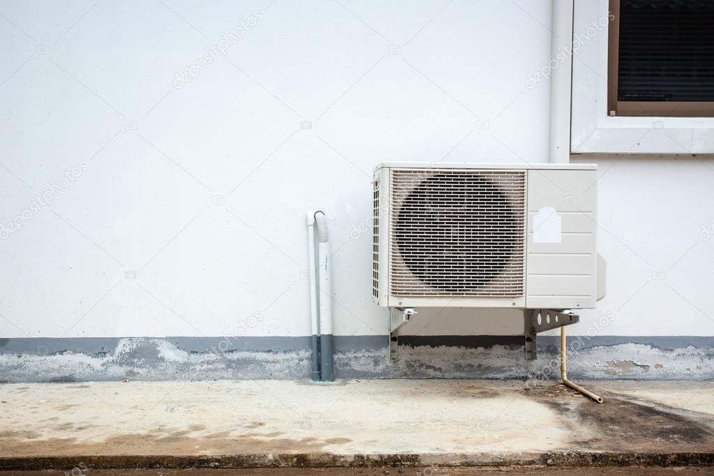 Air conditioner on the wall of boards.