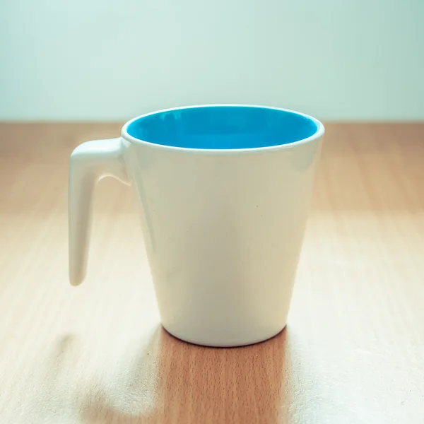 A cup of coffee on wooden background — Stock Photo, Image