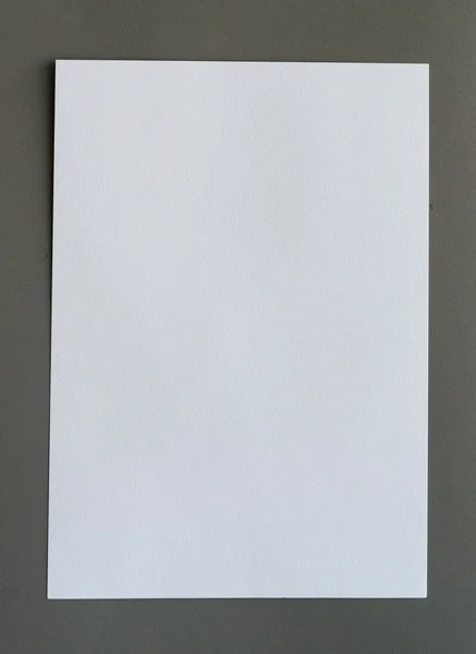 White crumpled paper on gray background vertical — Stock Photo, Image