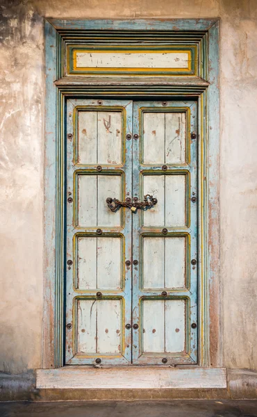 Traditional old door on home wall — Stock Photo, Image