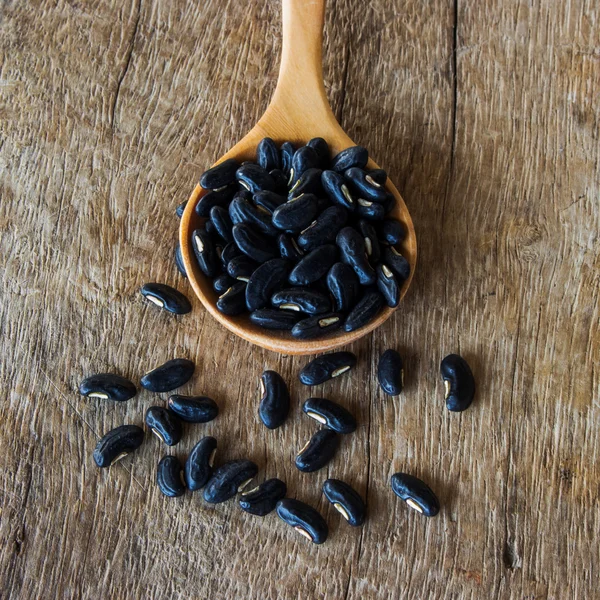 Close up bean seed spoon on wood table — Stock Photo, Image