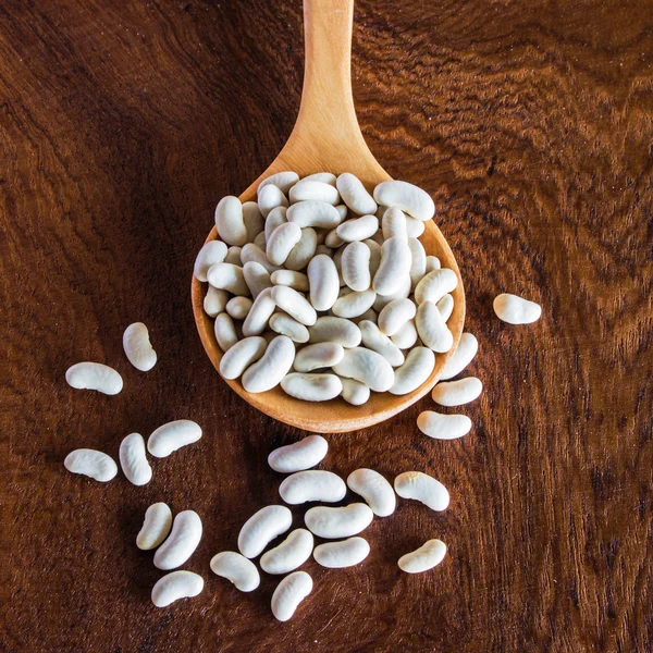 Close up bean seed spoon on wood table — Stock Photo, Image